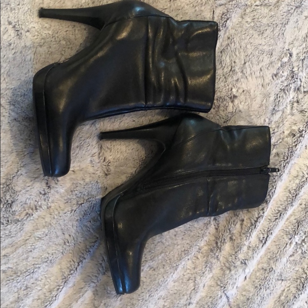 Black high heeled Nine West booties. 8 1/2
